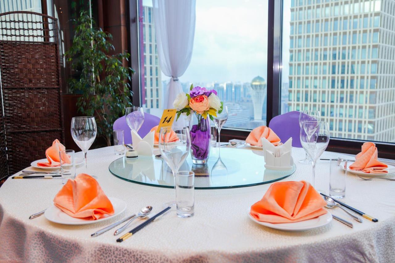 Beijing Palace Soluxe Hotel Astana Εξωτερικό φωτογραφία A table set for a banquet