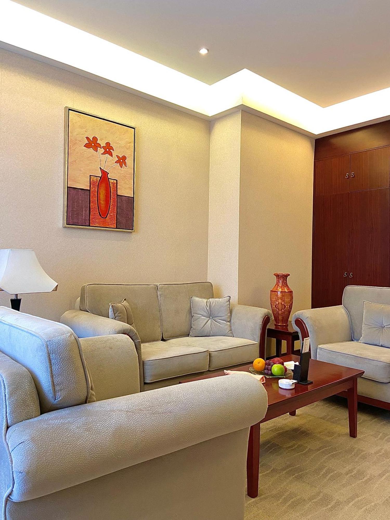 Beijing Palace Soluxe Hotel Astana Εξωτερικό φωτογραφία A living room in a typical apartment