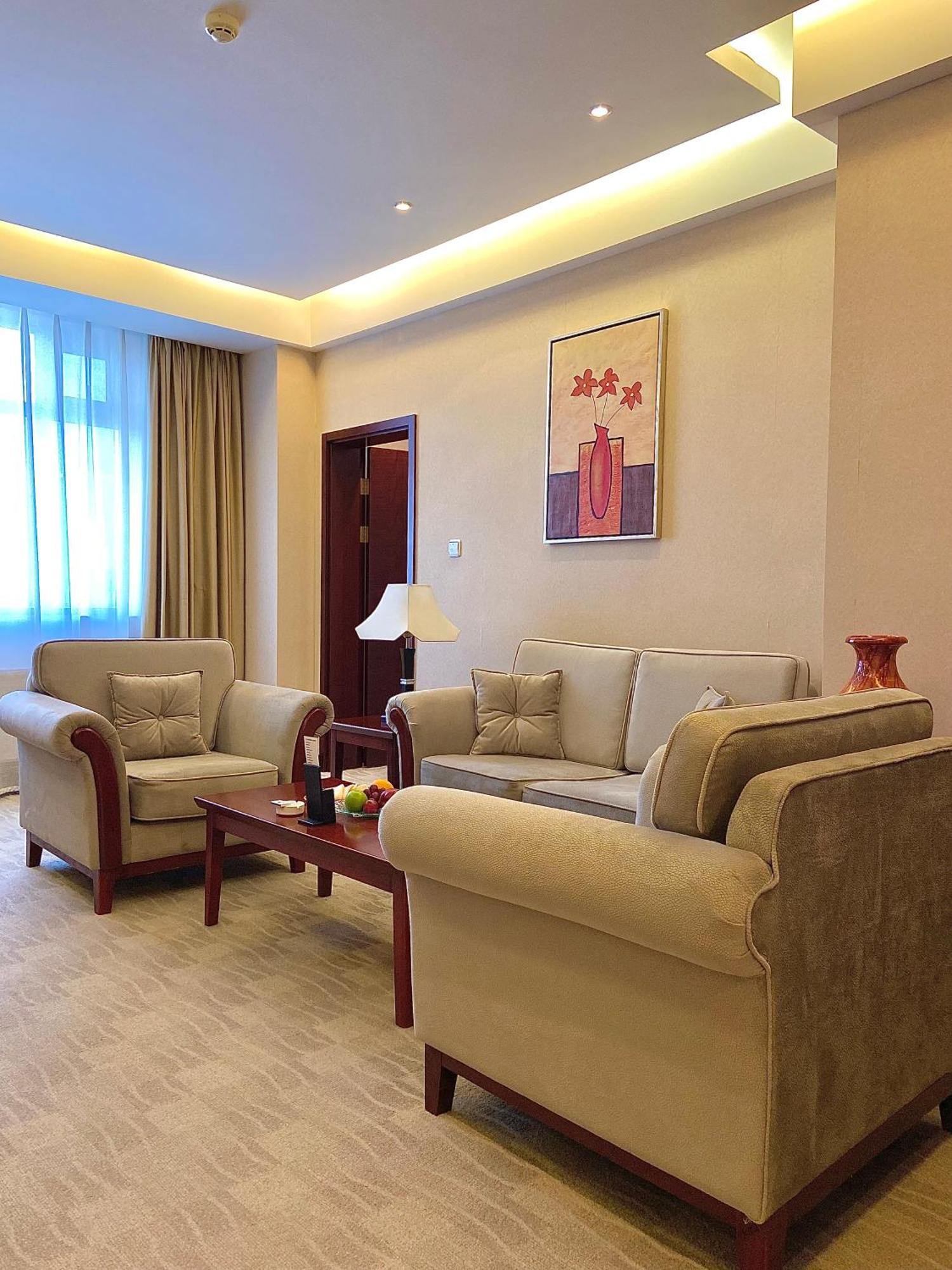 Beijing Palace Soluxe Hotel Astana Εξωτερικό φωτογραφία A living room in a suite at the hotel