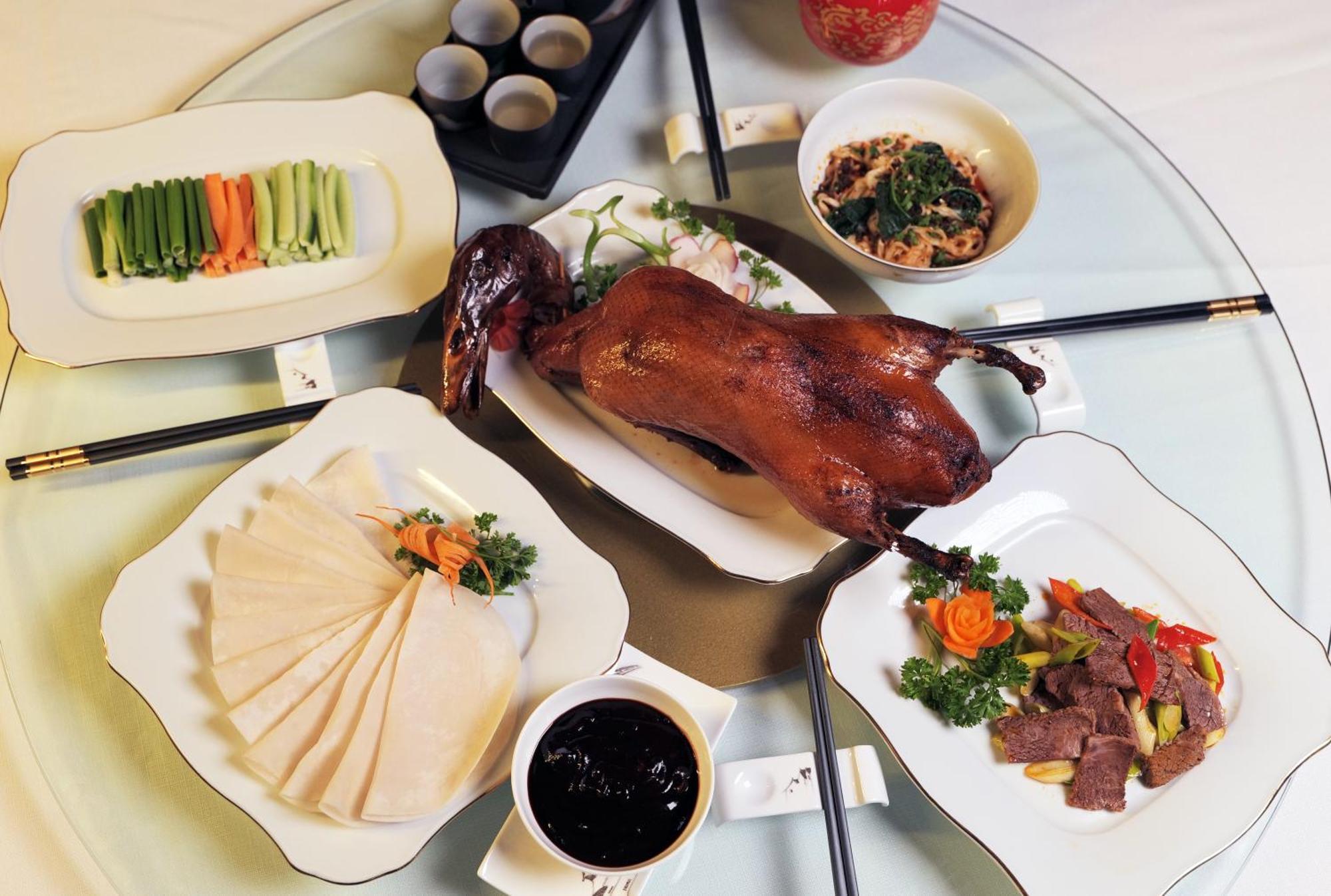 Beijing Palace Soluxe Hotel Astana Εξωτερικό φωτογραφία A selection of dishes prepared with duck